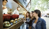 women at food truck ordering food