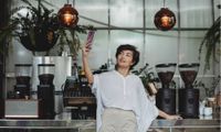 woman taking selfie in coffee shop