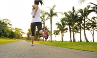 Girl running on path outdoors in day light
