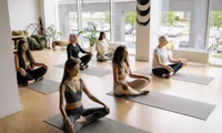 group of women doing yoga class