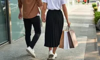 couple holding hands outdoor shopping