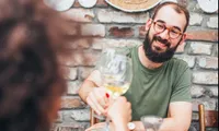 man toasting wine