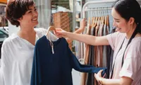 two women shopping at clothing boutique in daytime