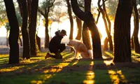 man with dog in park
