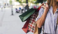 woman holding shopping bags