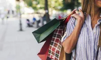 woman holding shopping bags