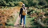 stylish man walking on trail
