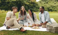 group of friends picnicking outside