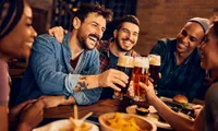 Friends cheersing beers