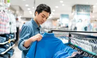 man shopping for shirts