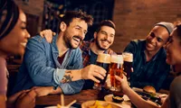 group of friends toasting a beer together