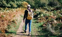 man walking on trail