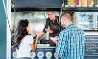 woman and man ordering from a food truck