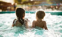 two kids in a pool