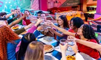 group of friends toasting with water eating together