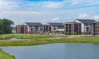 exterior of community with lakefront