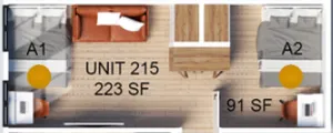 Compact and efficient floor plan for Unit 215 featuring two cozy sleeping areas, with a stylish common space, totaling 223 square feet.