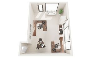 Modern office layout with sleek desks, ergonomic chairs, and large windows for natural light.