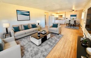 Spacious open-concept living and dining area with modern decor and natural light.