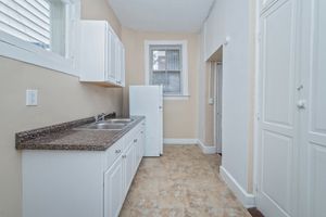 Charming kitchen with modern cabinetry, granite countertops, and natural lighting.