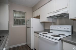Kitchen with electric range in 1 bedroom floor plan at Meadow Creek Apartments in Jackson, MS