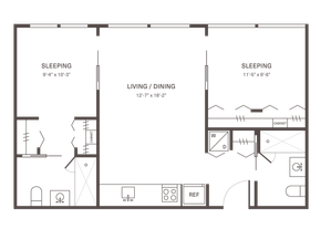 Inviting apartment floor plan showcasing two spacious sleeping areas, a large living and dining space, and modern kitchen with appliances.