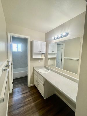 Spacious bathroom with elegant lighting and sleek countertop