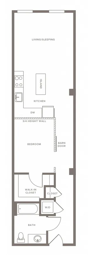Modern studio apartment floor plan featuring a combined living and sleeping area, stylish kitchen with island, cozy bedroom with barn door, bathroom, and ample closet space.