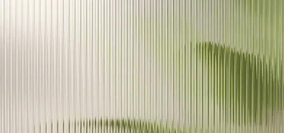 clear reeded glass with green leaf plant in background