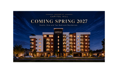 Elegant night view of Seasons at Capitol Hill, a modern apartment complex offering studio, one, and two-bedroom residences, opening Spring 2027.