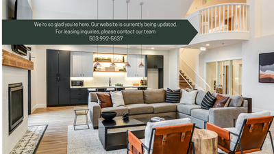 Bright and spacious living area with elegant modern design featuring a cozy fireplace, stylish open kitchen, and comfortable seating, perfect for relaxation.