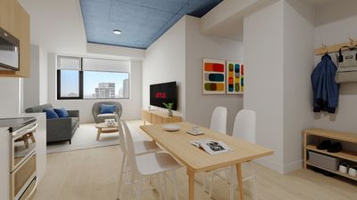 Sleek modern apartment with open-plan living area featuring stylish dining space, comfortable seating, and a vibrant decor, highlighted by a chic blue ceiling.
