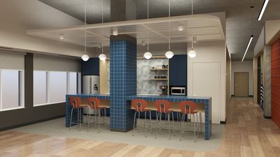 Modern kitchen featuring sleek blue tile accents, stylish pendant lighting, and a spacious island with contemporary seating.
