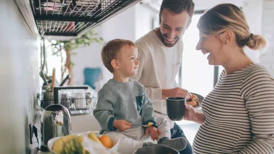 family together in kitchen