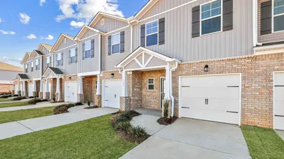 townhome exterior with brick accent