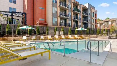 community pool with lounge chairs