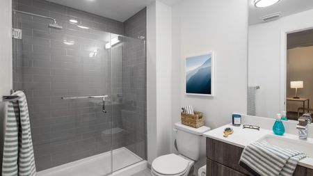 Spacious, large, modern bathroom with glass shower