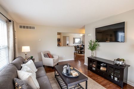 Residents Lounging in the Living Area | East Amherst NY Apartments | Autumn Creek Apartments