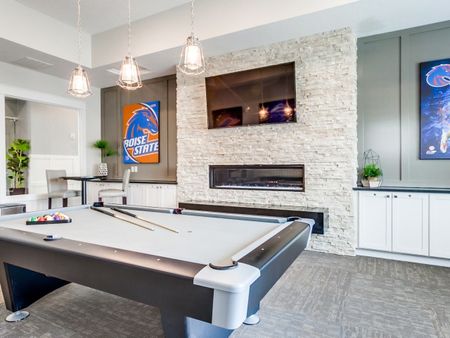 Game room with flat screen fireplace, seating area, and billiards table