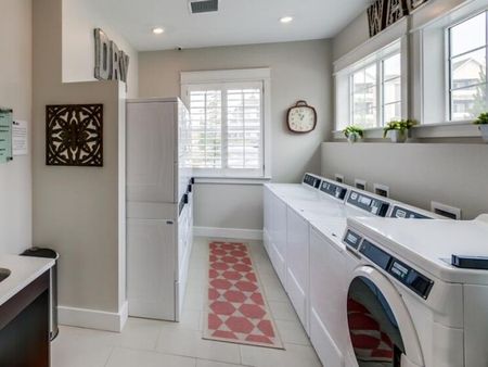 Laundry room with 4 washers and 6 dryers