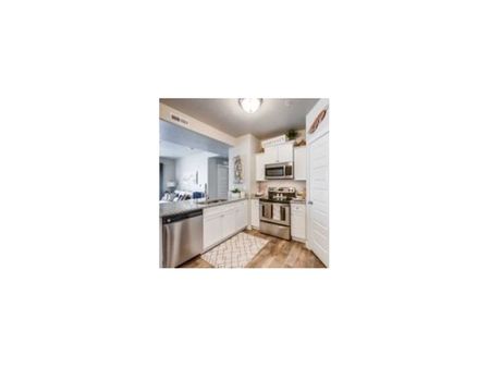 Kitchen with stainless steel dishwasher, double-sink, microwave, oven, stove, fridge/freezer combo and walk-in pantry