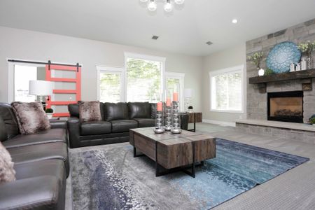 Clubhouse waiting room, 2 couches, coffee table, and fireplace