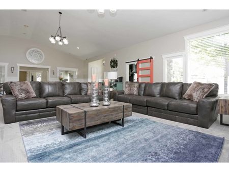 Office waiting room with two couches, coffee table, and side table