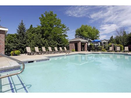 Rectangular pool with 10 tanning chairs