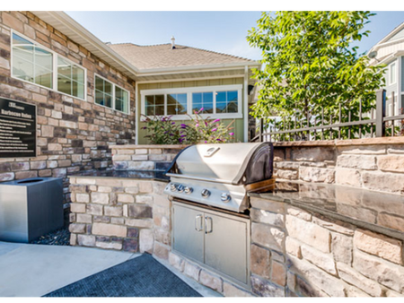 Barbecue area with stainless steel grill and granite counter top