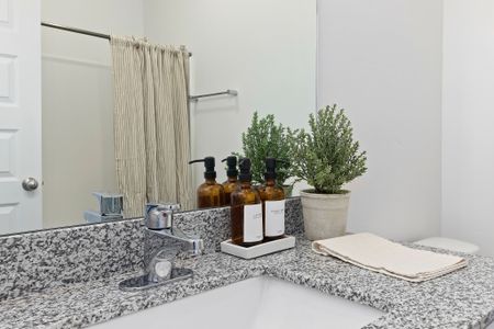 Master bathroom decor grey granite countertop and chrome hardware