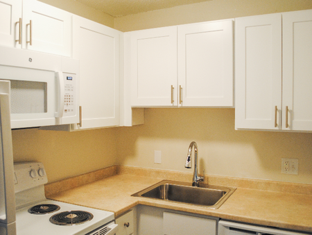 Kitchen - white on white cabinetry at Princeton Commons | Apartments in Claremont, NH