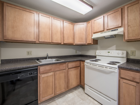Light-colored cabinetry in kitchen  in apartment at at Westford Park apartments in Lowell, MA.