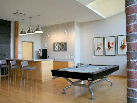 Pool table and serving area in community room at Washington Mill 240 apartments in Lawrence, MA.