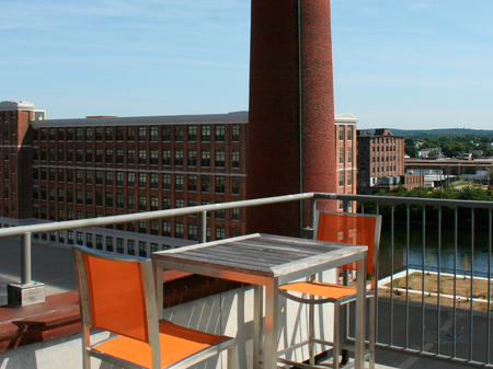 Rooftop Lounge with Tables and Chairs with View | Washington Mill 240 | Apartments For Rent In Lawrence, MA